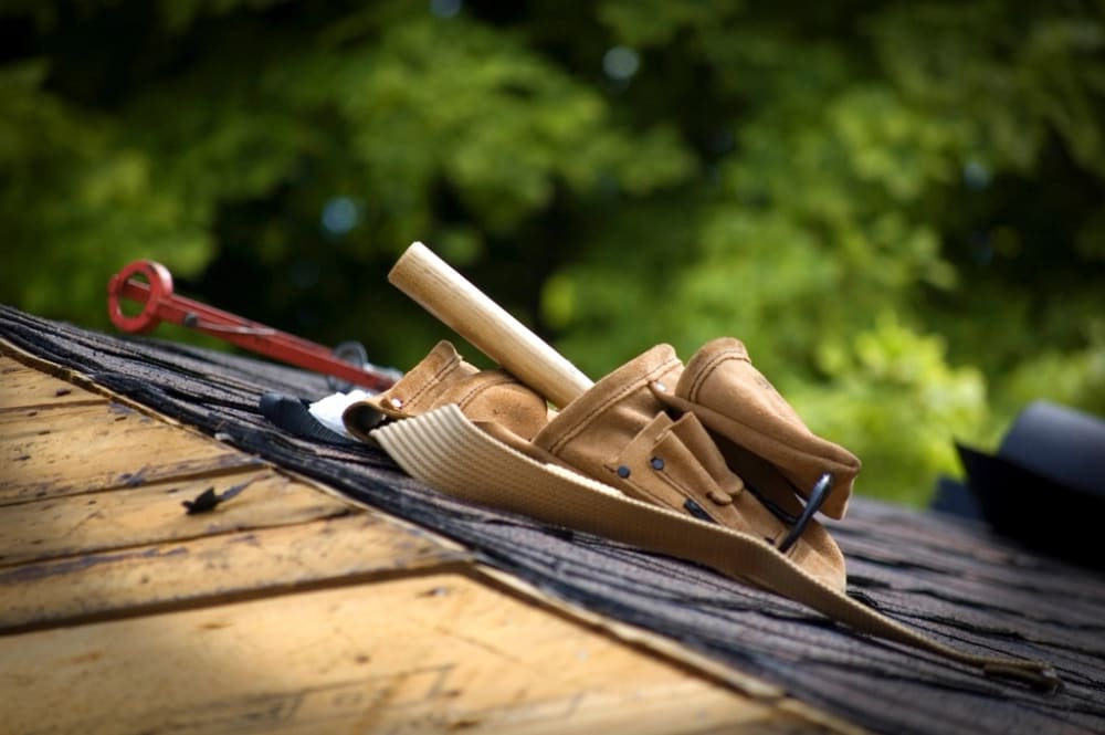 Roof repair tools on shingles