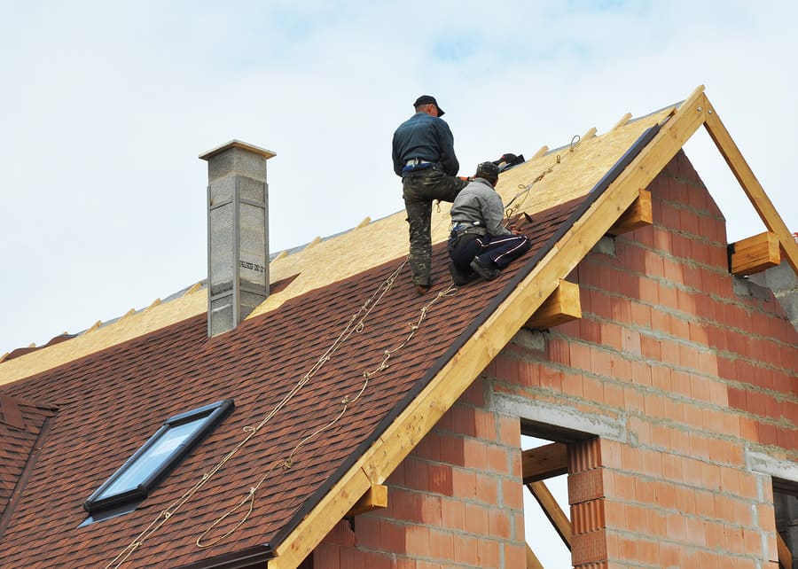 Crew working near a roof ridge